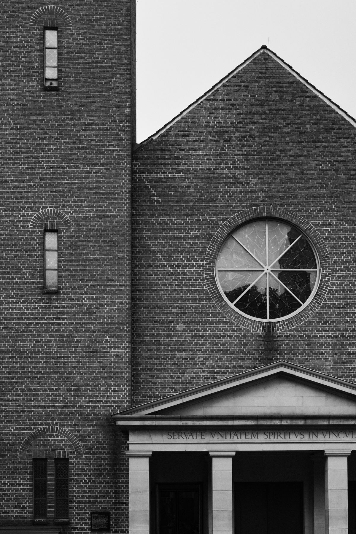 Brick church facade with round window
